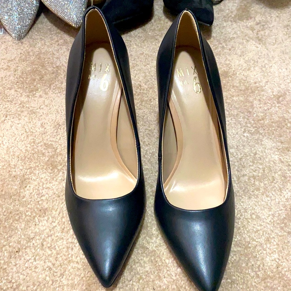 Black high heels, silver heel. Size 8. Closed toe. Worn once